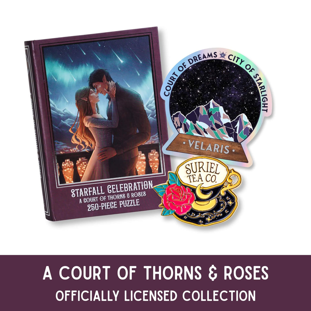 AStarfall puzzle with Feyre & Rhys, Velaris sticker, and Suriel Tea Co pin with the text Court of Thorns & Roses officially licensed collection