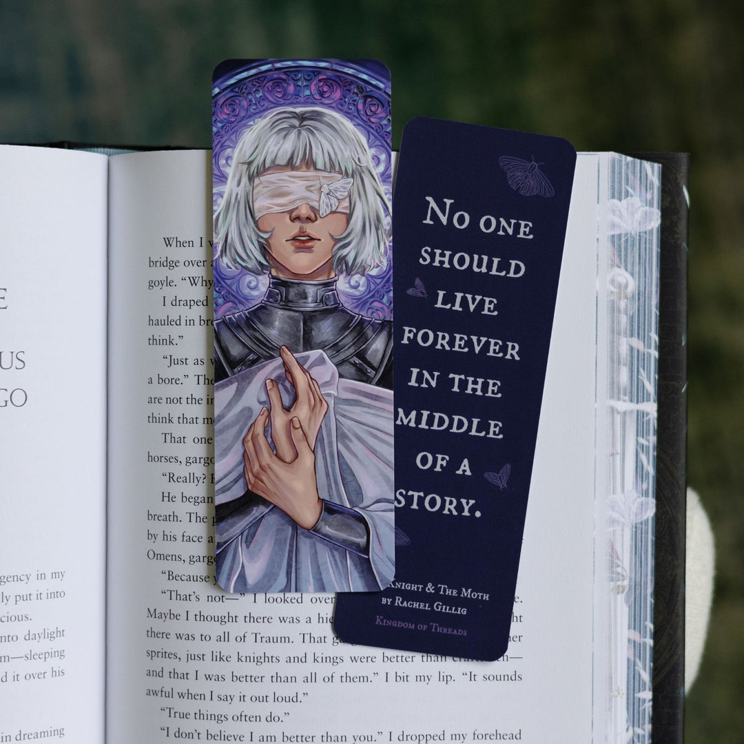 Two purple bookmarks in an open book: one with Sybil in her armor and shroud. On the other ‘‘No one should live forever in the middle of a story.’