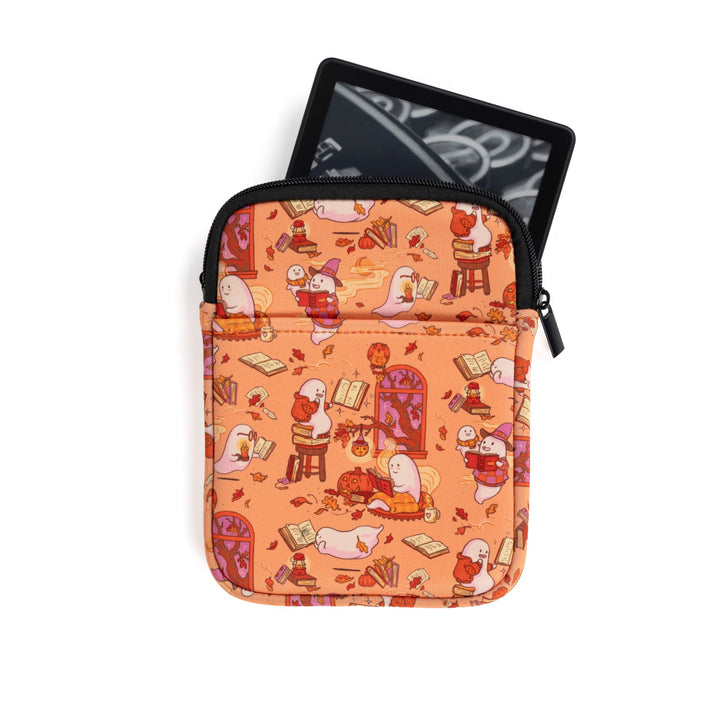 Small zippered booksleeve with orange background and ghosts reading books. An E-reader is sticking out.