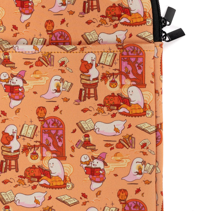Closeup of outside pocket and zipper on booksleeve with orange background and ghosts reading books.