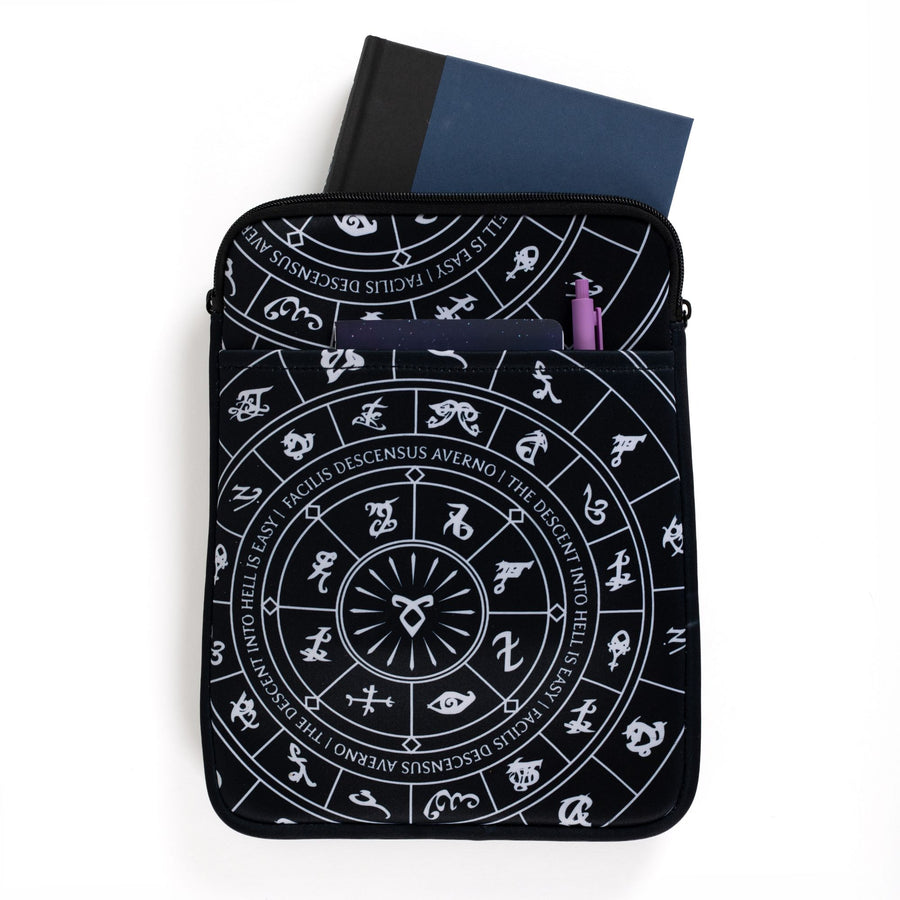 Large zippered booksleeve with black background and white Shadowhunters runes. A hardcover is sticking out. 
