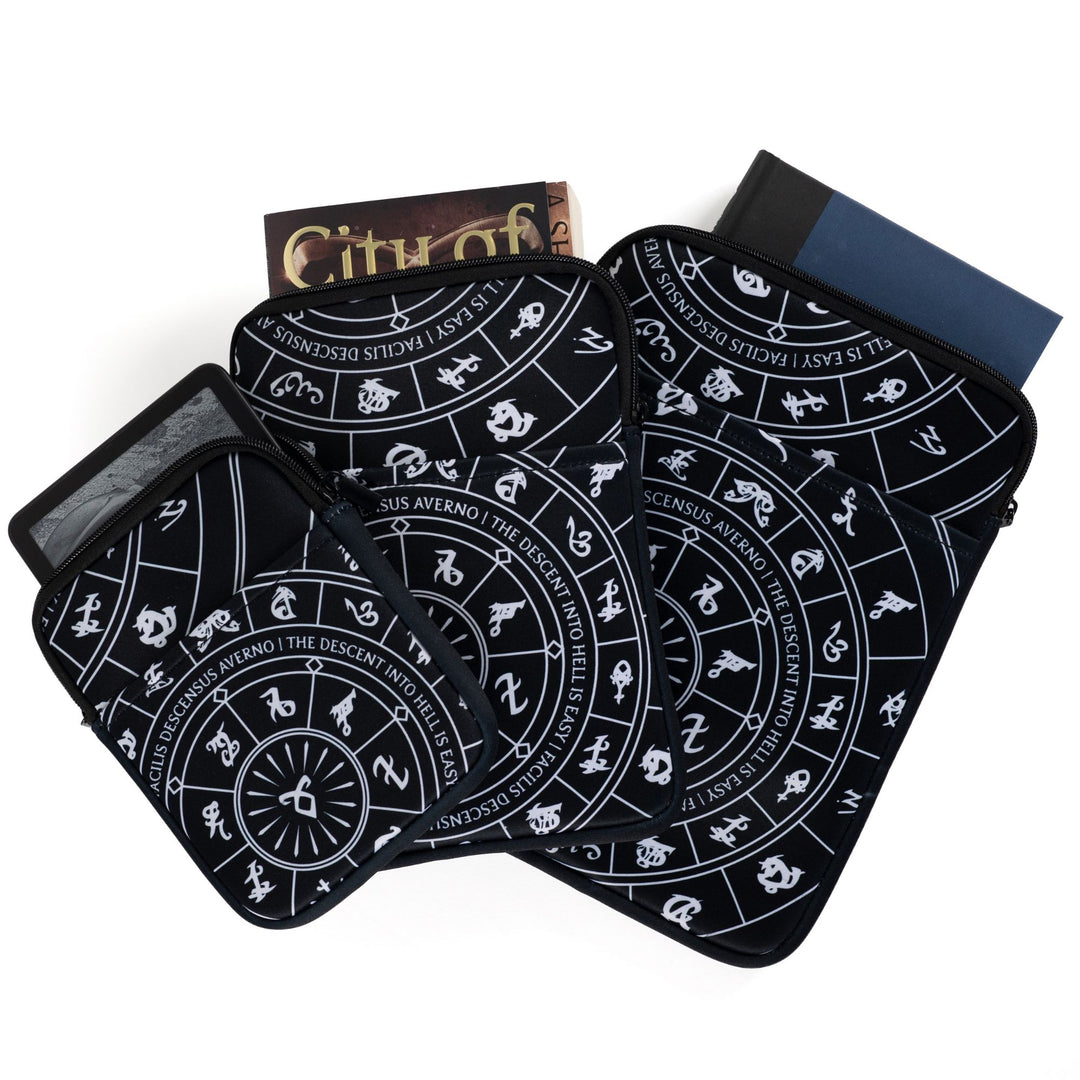 Three sizes of zippered booksleeves with black background and white Shadowhunters runes. A book sticks out of each.
