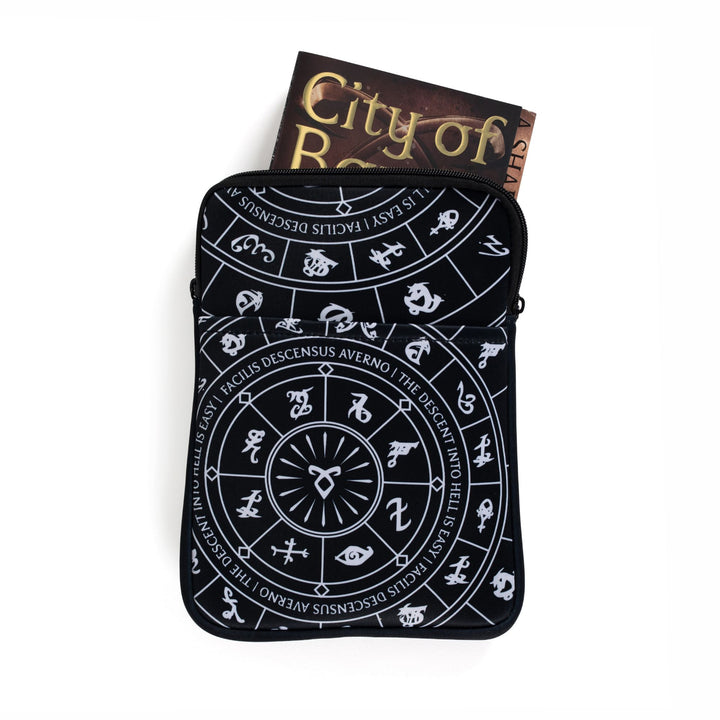 Medium zippered booksleeve with black background and white Shadowhunters runes. A paperback is sticking out.
