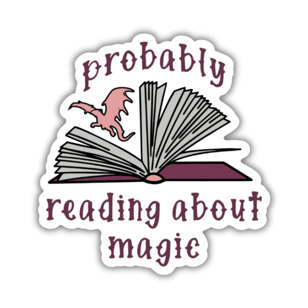  Sticker of an open book with a dragon flying out of the middle and text ‘Probably reading about magic’.

