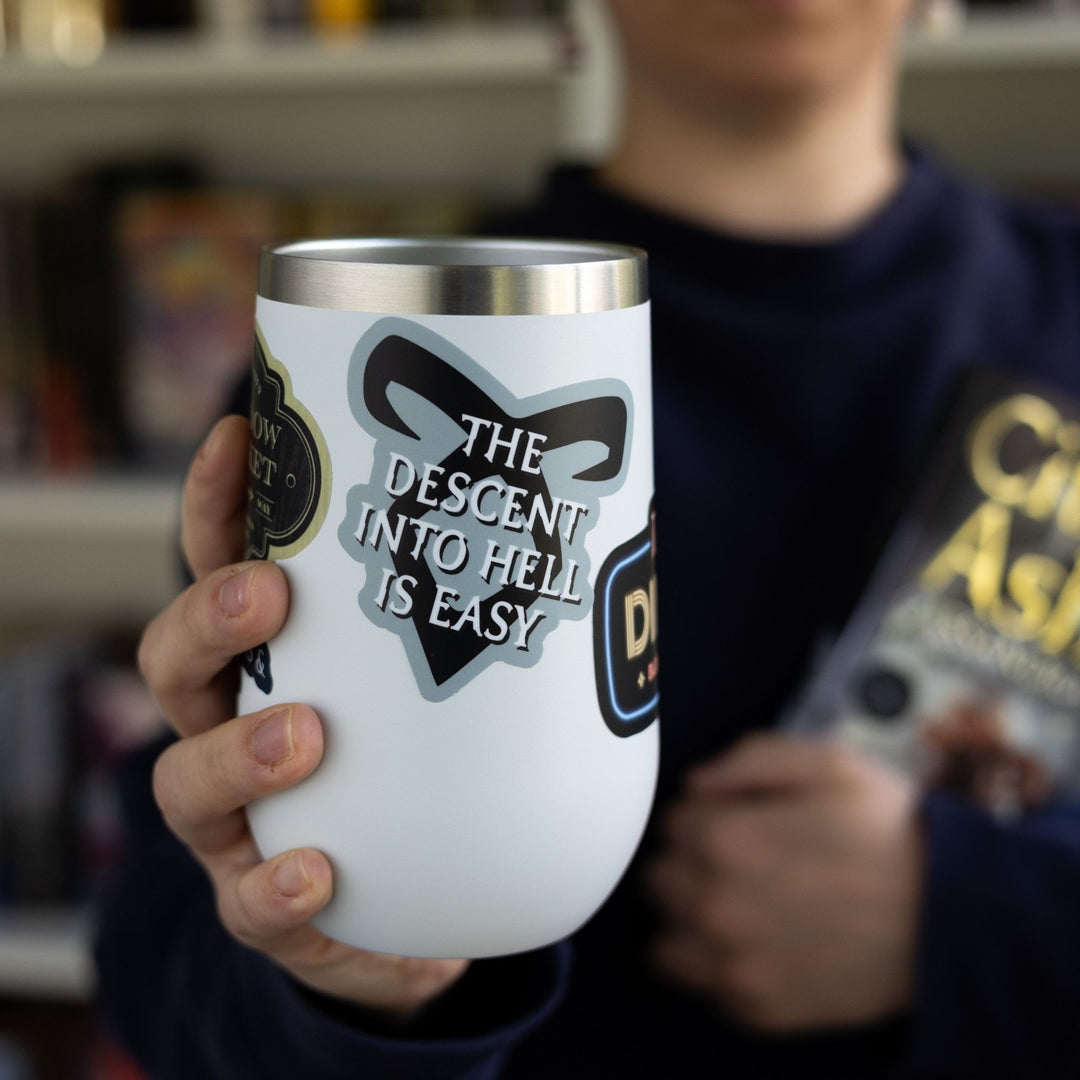 Sticker on a  white tumbler reads ‘The descent into hell is easy’ with enkeli rune from Shadowhunters.