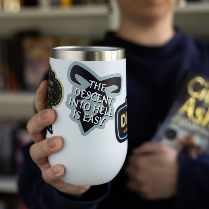 Sticker on a  white tumbler reads ‘The descent into hell is easy’ with enkeli rune from Shadowhunters.