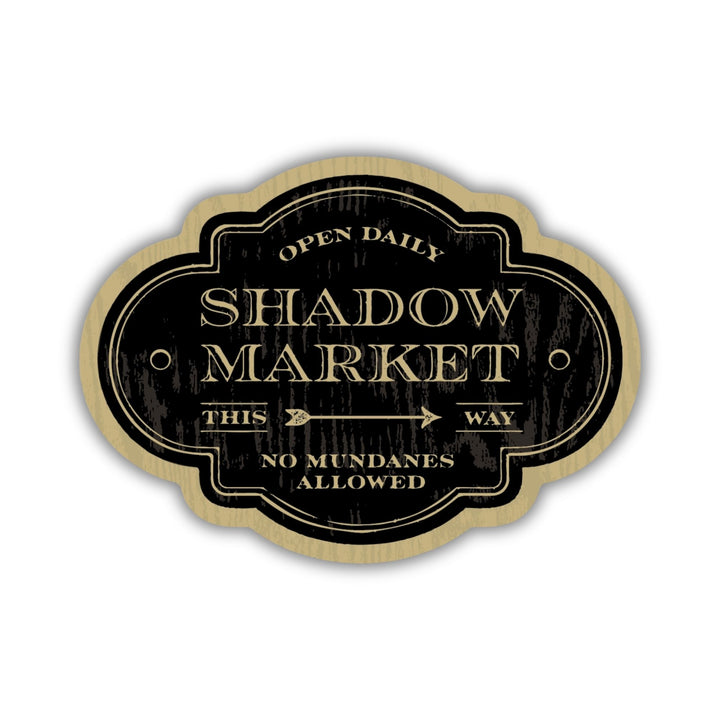 Sticker looks like an antique sign and reads ‘Open daily. Shadow Market, this way. No mundanes allowed.’