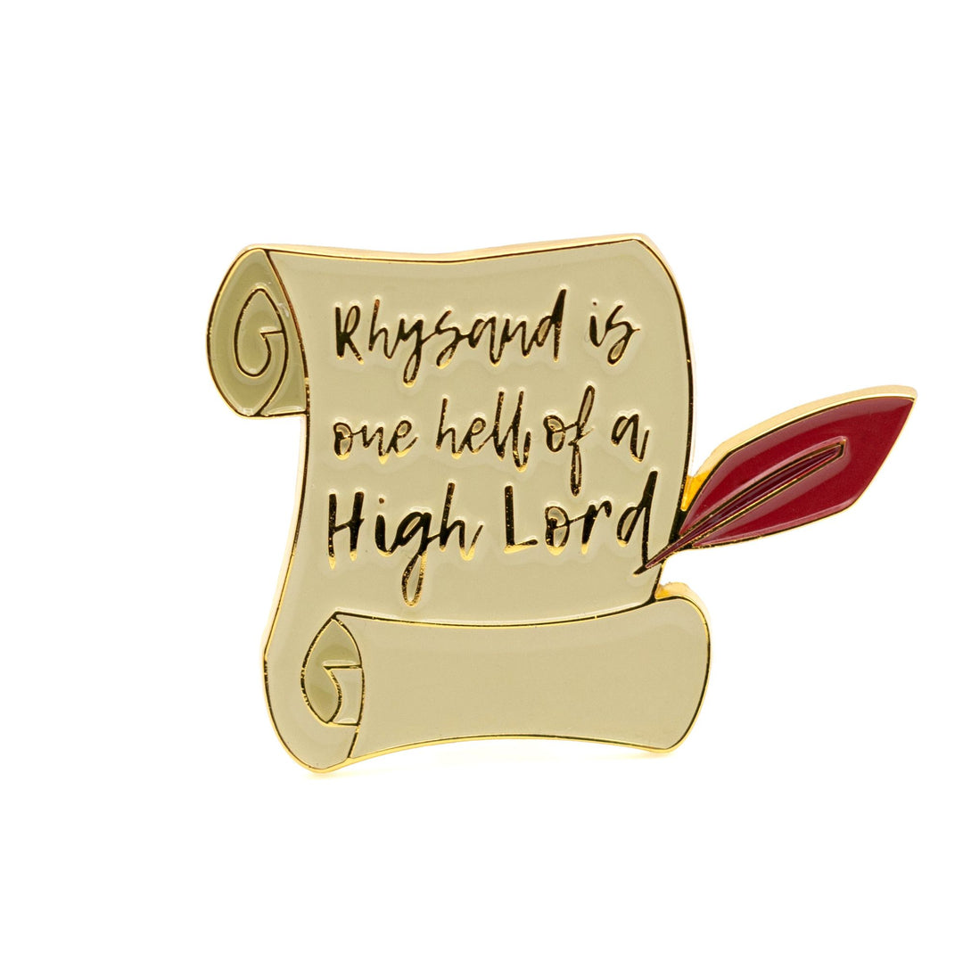 Enamel Pin of a scroll and red quill that reads ‘Rhysand is one hell of a high lord’.