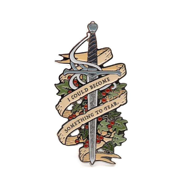  Enamel pin of Jude’s sword Nightfell with banner that reads ‘I could become something to fear’ in gray metal. From The Cruel Prince.