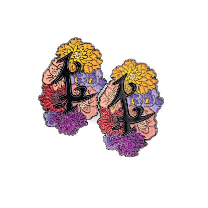 Black enamel pin of parabatai rune from Shadowhunters, surrounded by flowers. 