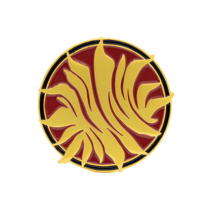 Enamel pin inspired by Red Queen. The pin is a gold, metal sunburst on a red, circular background.