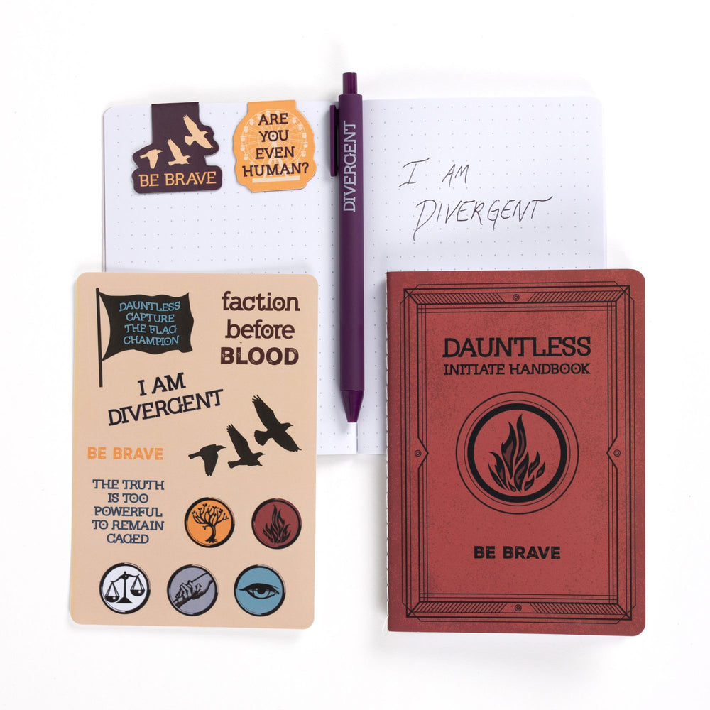 Gift set opened: Dot grid A6 journal open with pen, ‘Be brave’ & 'Are you even human?' magnetic bookmarks, Divergent sticker sheet, A6 red Dauntless journal.