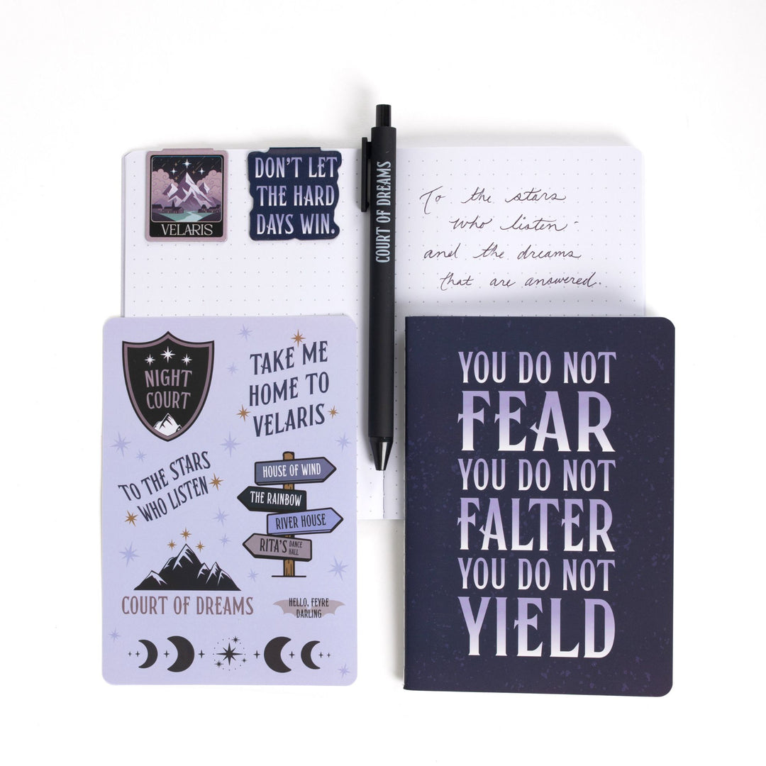 Gift set opened: Dot grid A6 journal open with pen, ‘Court of dreams ',  magnetic bookmarks, Velaris sticker sheet, A6 Velaris & You do not fear you do not falter you do not yield’  journal.