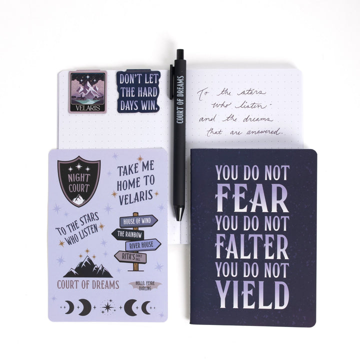 Gift set opened: Dot grid A6 journal open with pen, ‘Court of dreams ',  magnetic bookmarks, Velaris sticker sheet, A6 Velaris & You do not fear you do not falter you do not yield’  journal.