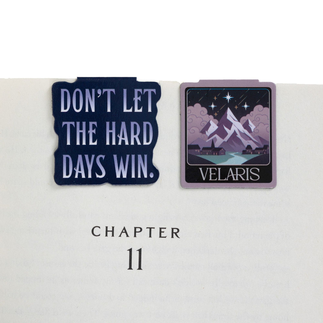 ’Don’t let the hard days win’  & 'Velaris' magnetic bookmarks on open book. Quote and city from ACOTAR.