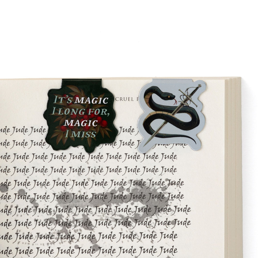  Serpent King Cardan & 'It’s magic I long for, magic I miss’ magnetic bookmarks on open book. Quote from The Cruel Prince.
