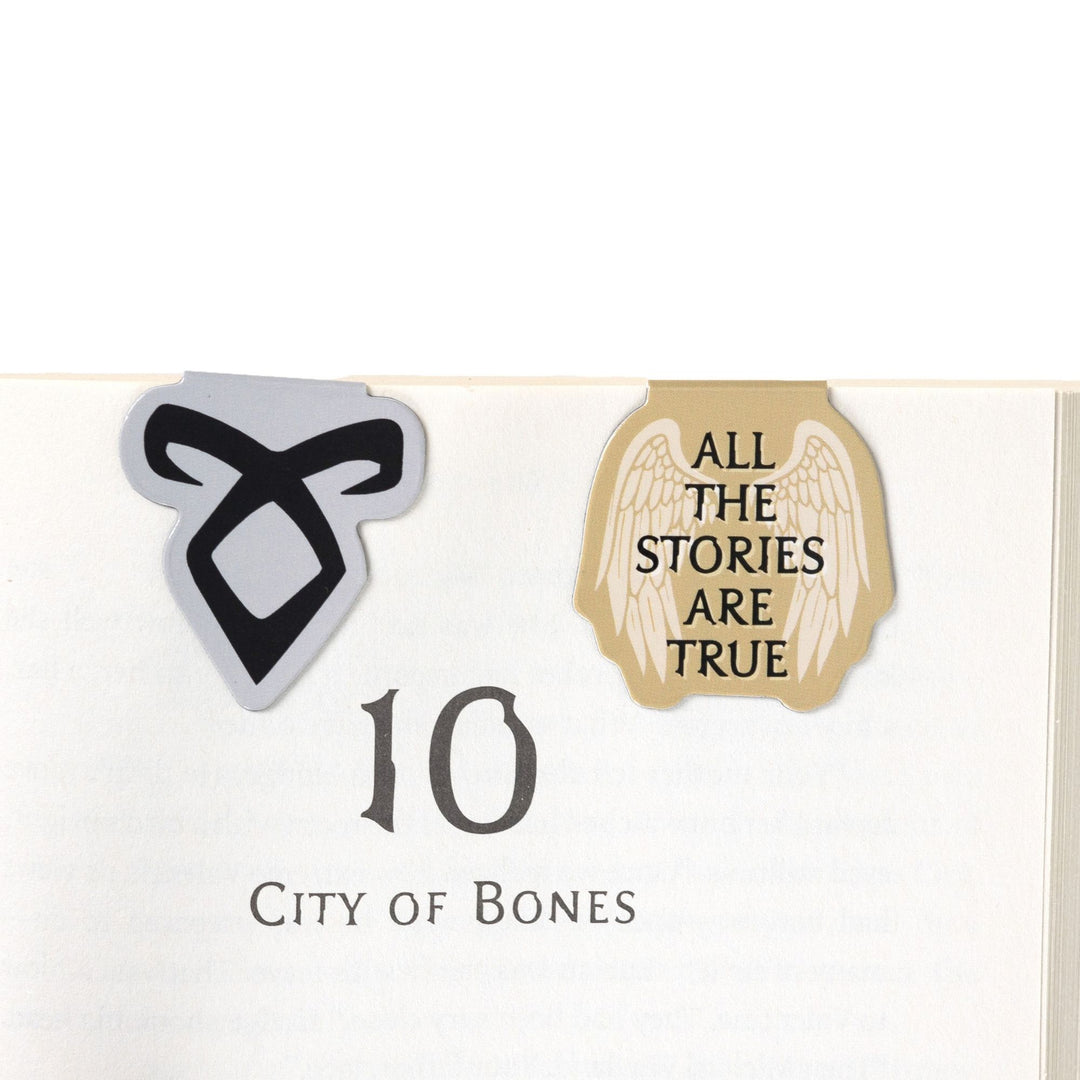‘All the stories are true’ & Enkeli rune magnetic bookmarks on open book. From Shadowhunters.
