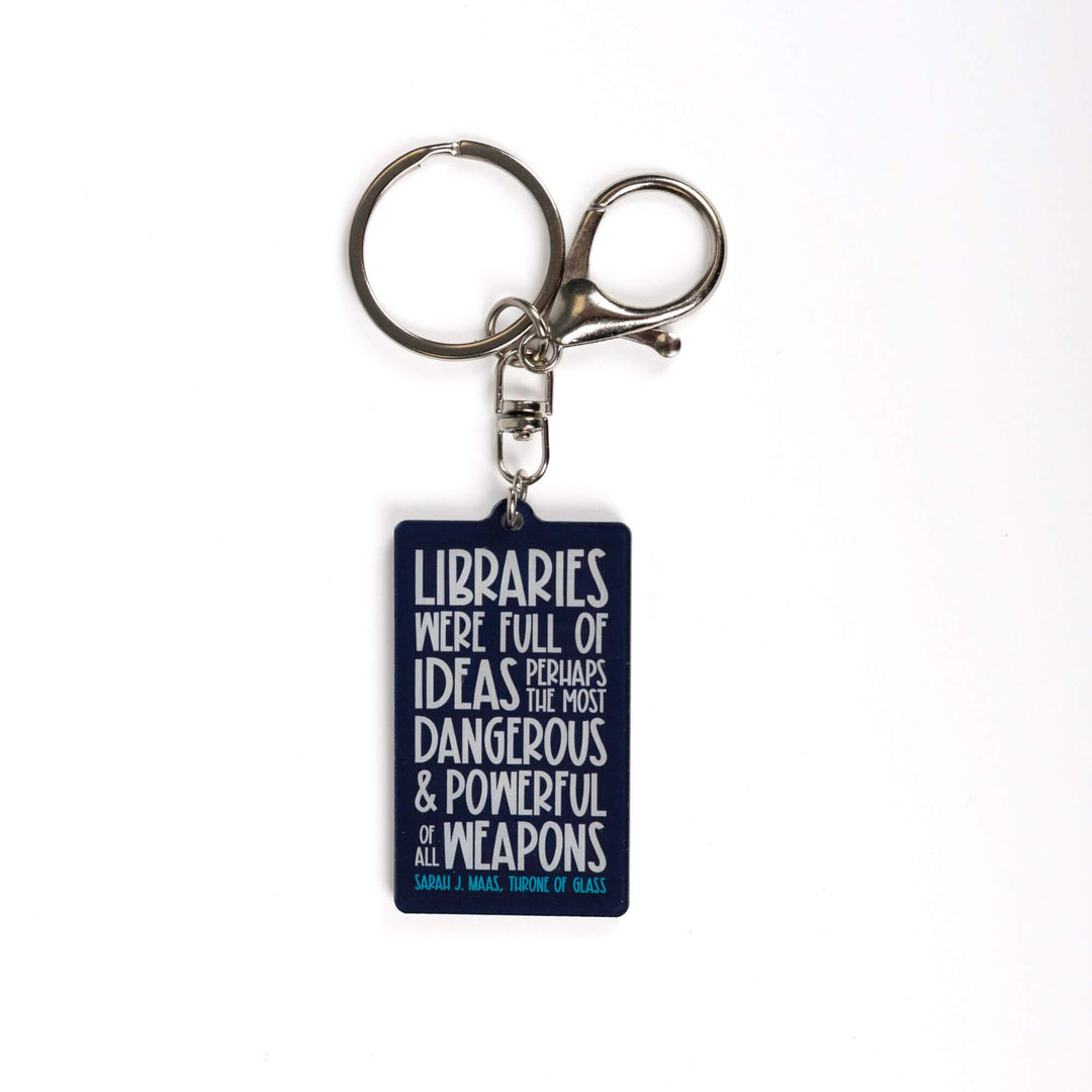Dark blue acrylic keychain 'Libraries were full of ideas, perhaps the most dangerous and powerful weapons of them all. Sarah J. Maas Throne of Glass.’ in white lettering