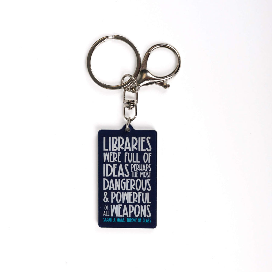 Dark blue acrylic keychain 'Libraries were full of ideas, perhaps the most dangerous and powerful weapons of them all. Sarah J. Maas Throne of Glass.’ in white lettering