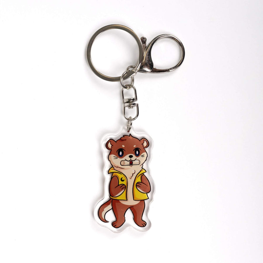Acrylic keychain of an otter with a scroll in its mouth, standing on its hind legs and wearing a yellow vest. From Crescent City.
