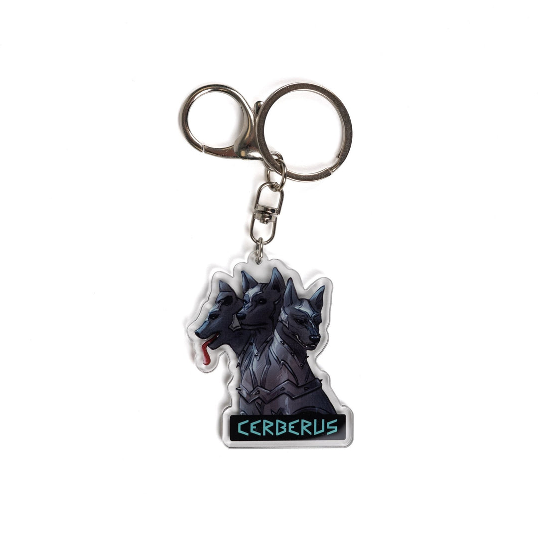 Acrylic keychain of the 3 headed dog, Cerberus in armor. One head stoic, one head smiling, one silly with its tongue out. 
