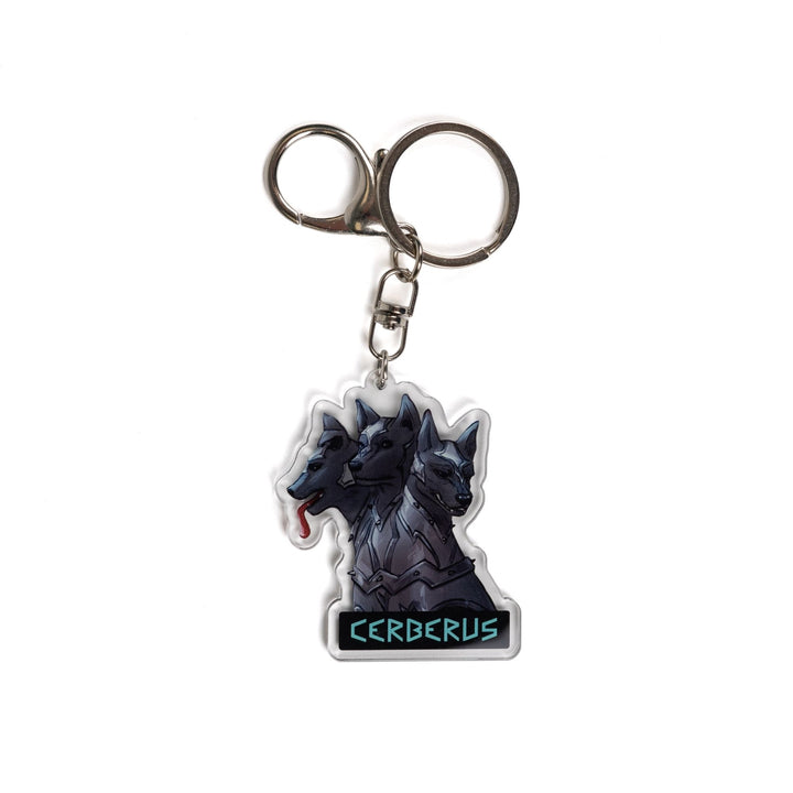 Acrylic keychain of the 3 headed dog, Cerberus in armor. One head stoic, one head smiling, one silly with its tongue out. 
