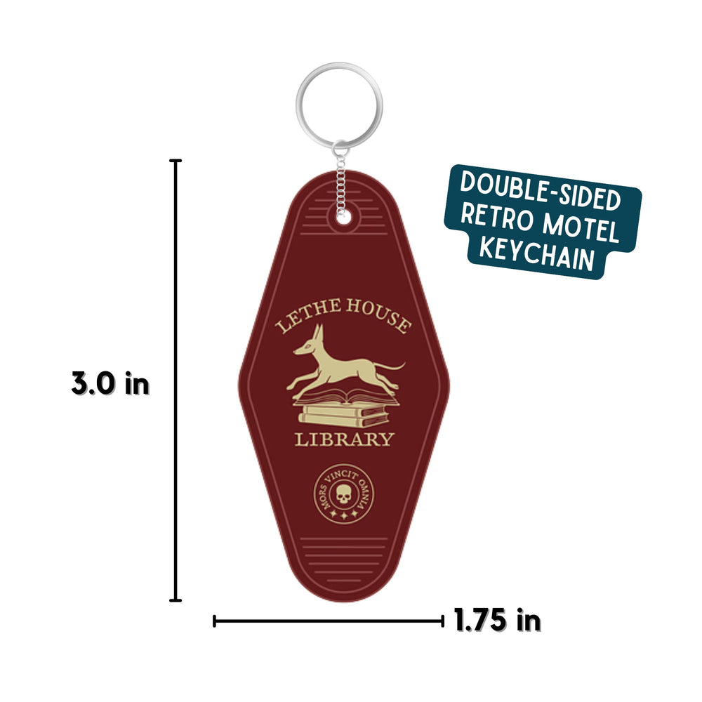 Double sided motel keychain with an illustration of a jackal bounding over a stack of books that reads ‘Lethe House Library, Mors Irrumat Omnia.’ with dimensions displayed of 3 in by 1.75 in.