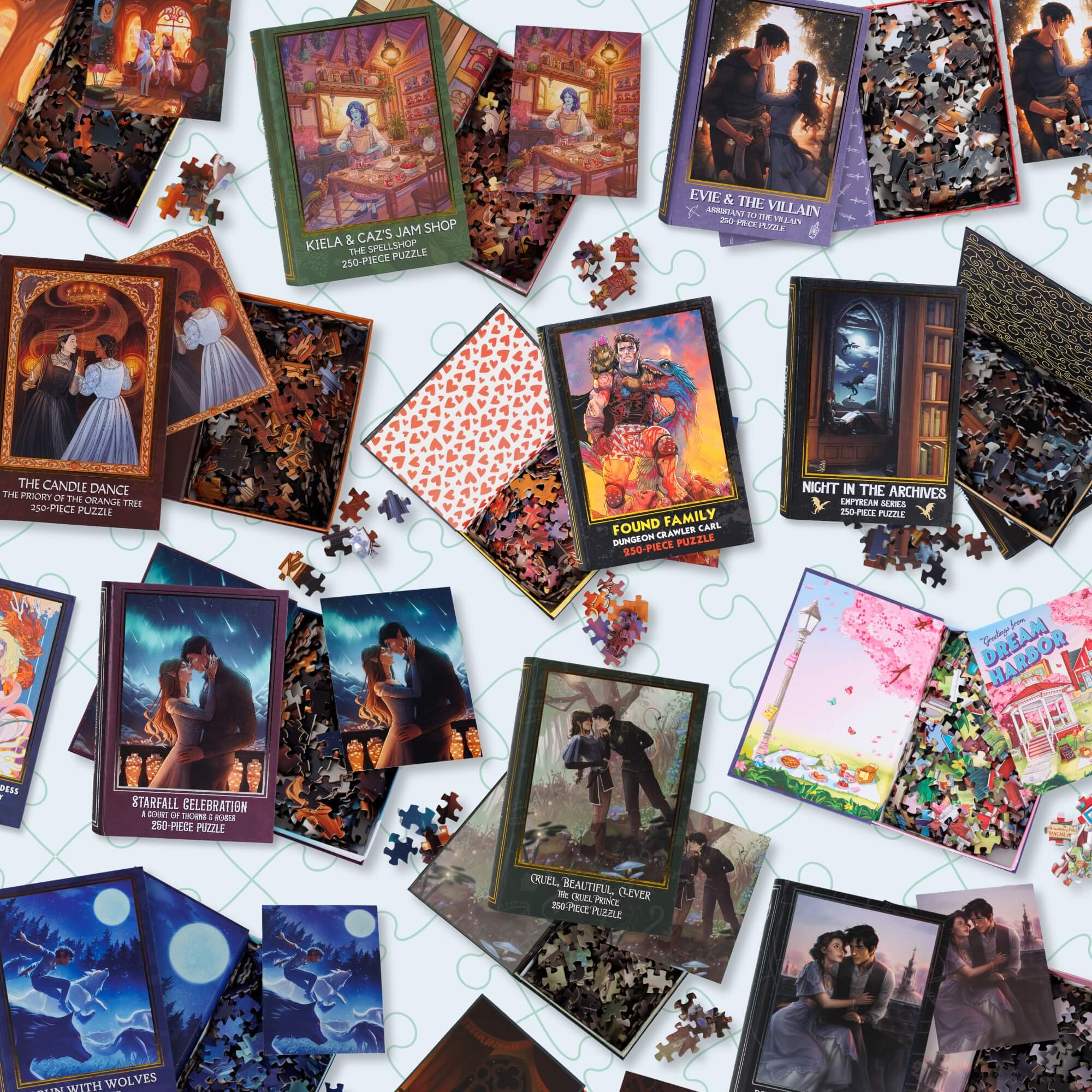 Collection of bookish puzzle boxes, open to show off pieces and artwork