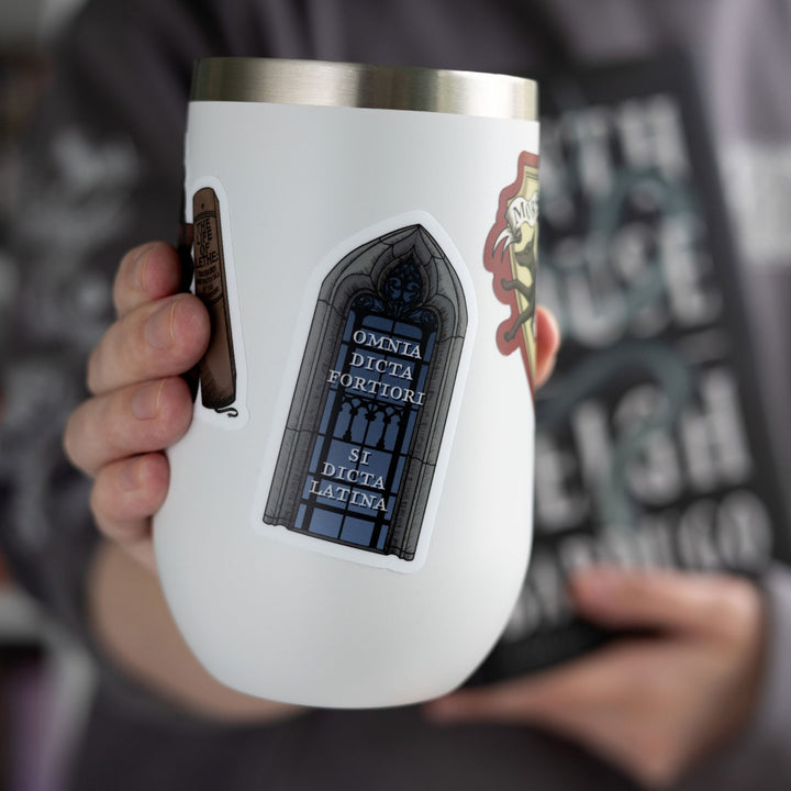 Sticker of Sterling library window with text ‘Omnia Dicta Fortiori Si Dicta Latina’ on a white tumbler.
