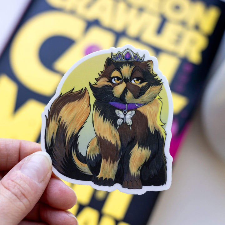 Sticker of Princess Donut wearing her signature crown and purple butterfly collar around a yellow ombre background held above Dungeon Crawler Carl.
