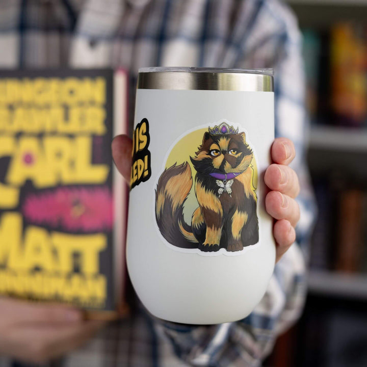 Sticker of Princess Donut wearing her signature crown and purple butterfly collar around a yellow ombre background displayed on a white tumbler.
