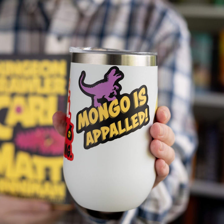 Sticker of ‘Mongo is appalled’ in yellow text with purple adult Velociraptor on top of words on a white tumbler.
