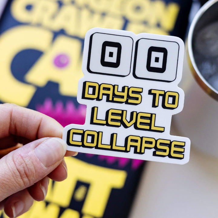 Sticker of two zeros are above ‘Days to level collapse’ in yellow. It is a countdown. Held over Dungeon Crawler Carl.