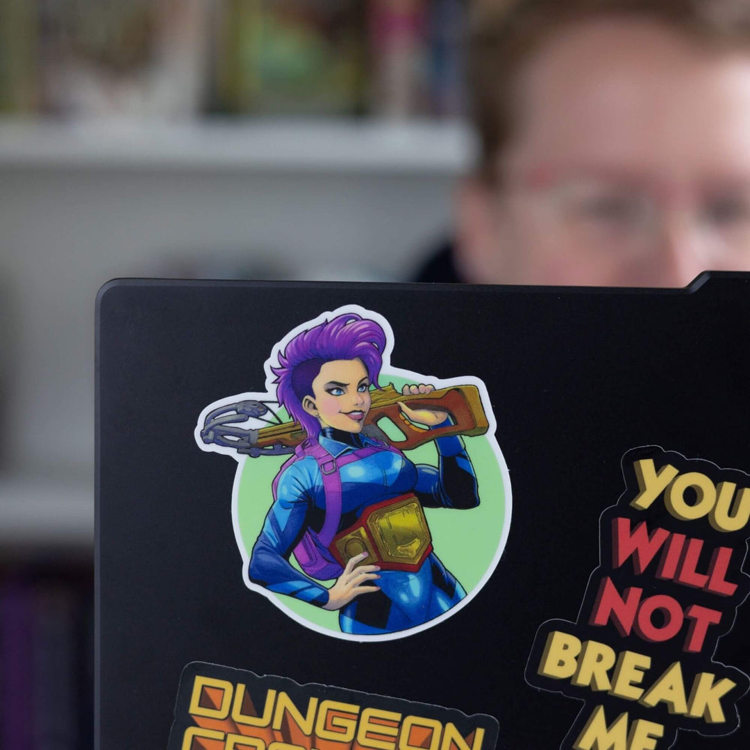 Sticker of Katia in a blue spandex suit, a purple backpack and cross-bow slung over her shoulder smirking, from Dungeon Crawler Carl. On a black laptop.