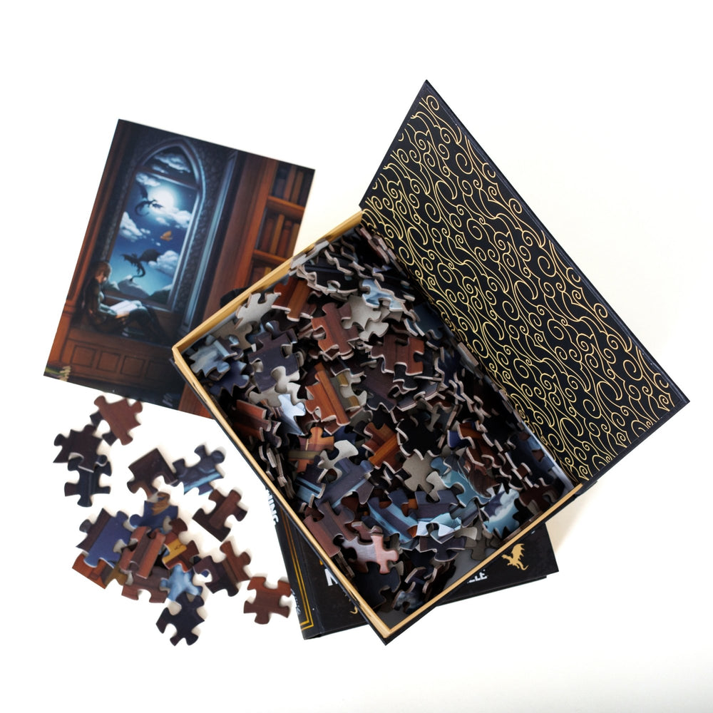 An open book-shaped box reveals puzzle pieces. Black and gold filigree design on the inner flap. An art print of Violet in the library atop the pieces.