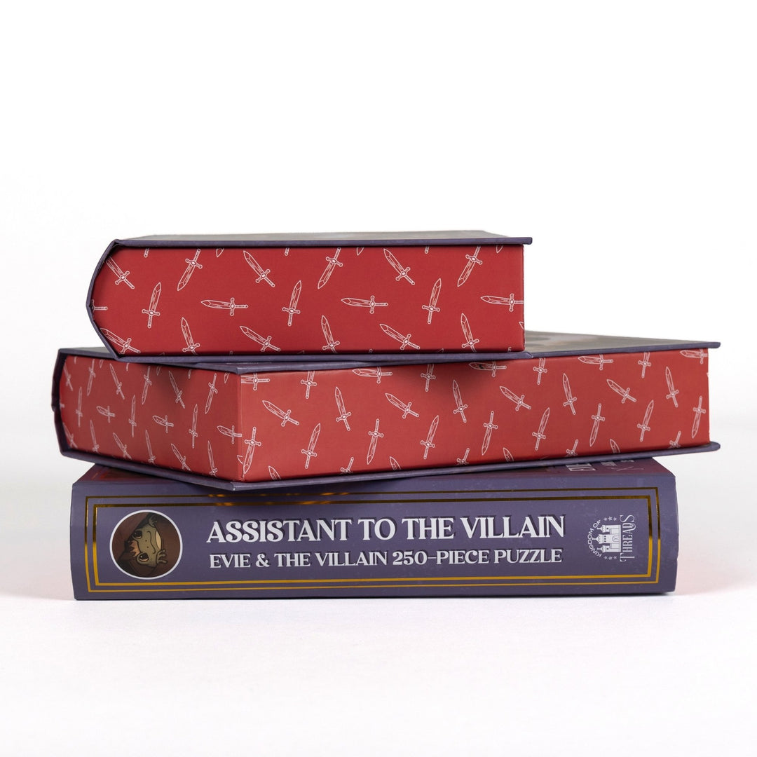 Stack of 3 puzzle boxes showing all sides. Red edges with white swords and the spine of the box reads Assistant to the Villain Evie and The Villain 250-piece puzzle