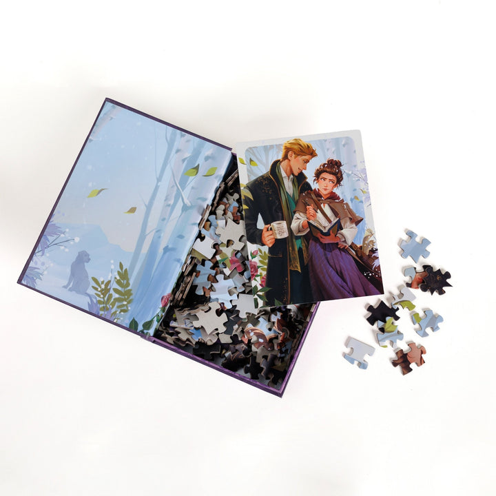An open book-shaped box reveals puzzle pieces. Inner art on the top flap of a birch forest. An art print of Emily and Wendell atop the pieces.