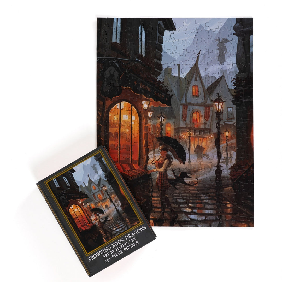 Full completed puzzle of rainy day street scene outside a bookstore and a black, book-shaped box  with matching art for Browing Book Dragons 250-piece puzzle.