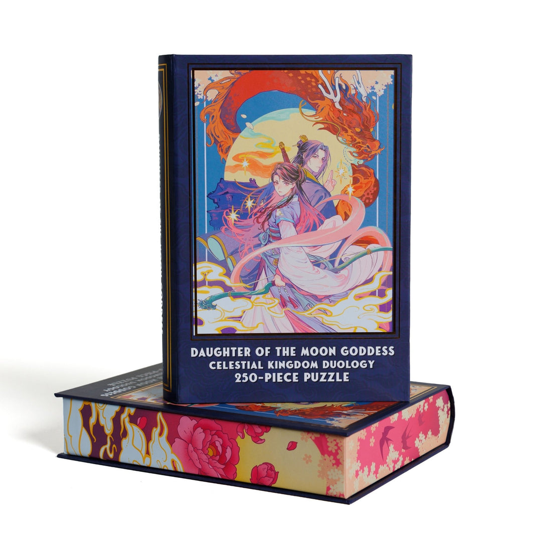 Book-shaped black box for Daughter of the Moon Goddess Celestial Kingdom Duology 250-piece puzzle. Anime style art on the front is of Xingyin and Prince Liwei.