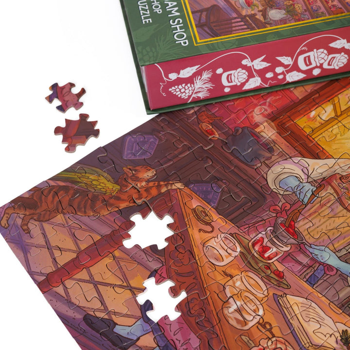 Close up of completed puzzle of Kiela making jam in her kitchen from The Spellshop with two pieces missing.