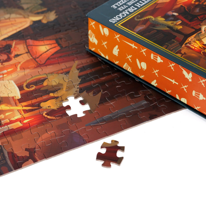 Close up of a completed puzzle of a woman at a writing desk with three small dragons with one piece missing.