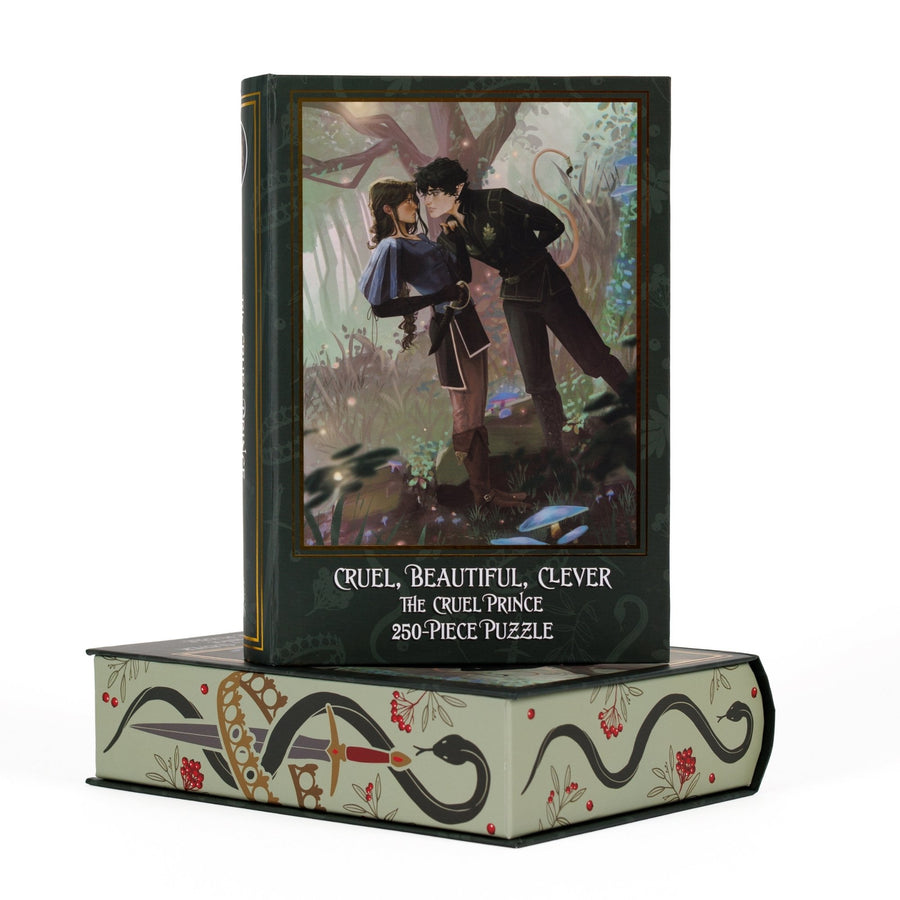 Book-shaped green box for Cruel, Beautiful, Clever The Cruel Prince 250-piece puzzle. Art on the front is of Cardan and Jude in the forest.
