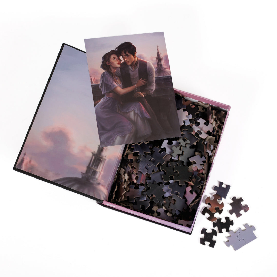 An open book-shaped box reveals puzzle pieces. Inner art on the top flap the London skyline. An art print of Will and Tessa atop the pieces.