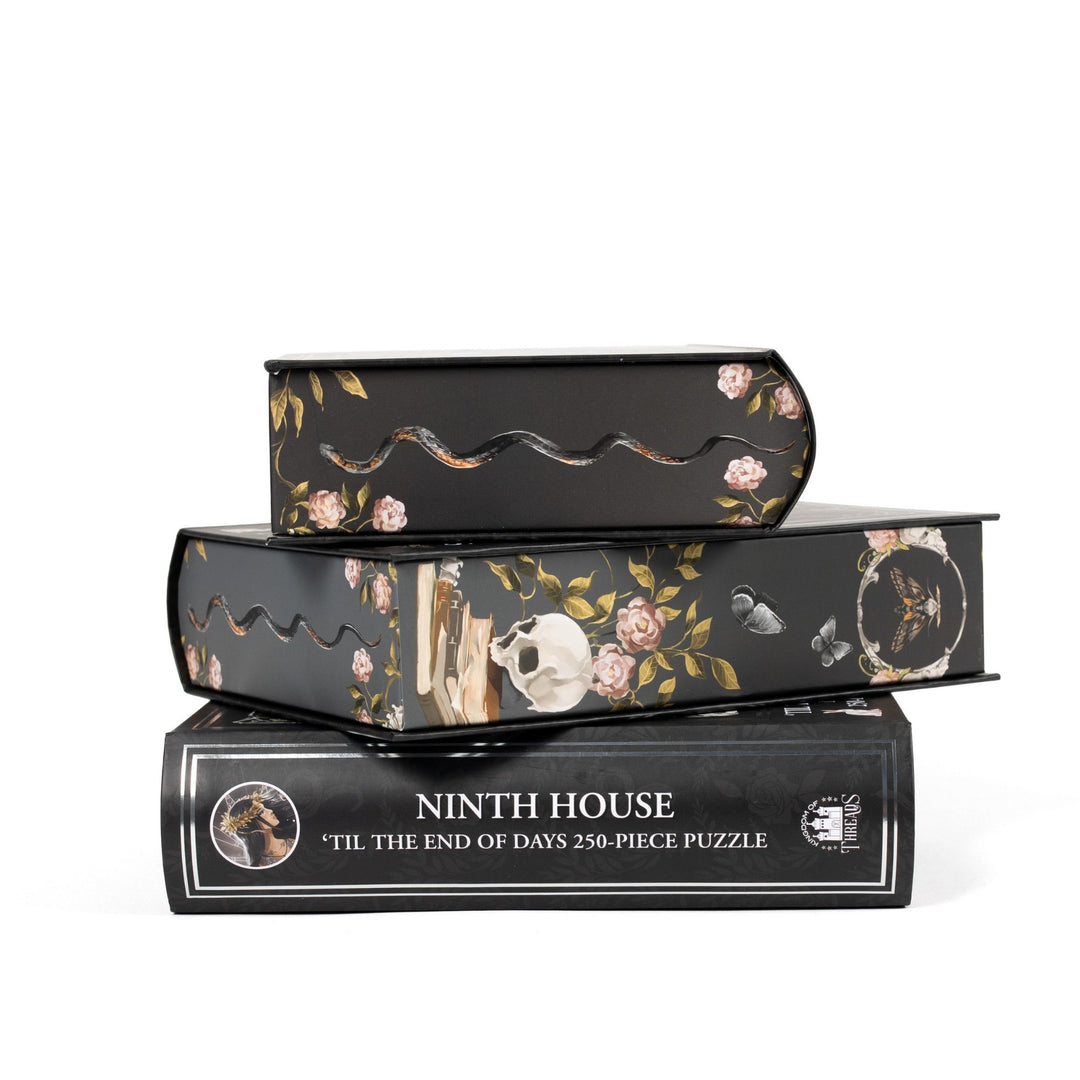 Stack of 3 puzzle boxes showing all sides. Black edges with illustrated snakes and skulls. The spine of the box reads ‘Ninth House Til the End of Days 250-piece puzzle.’