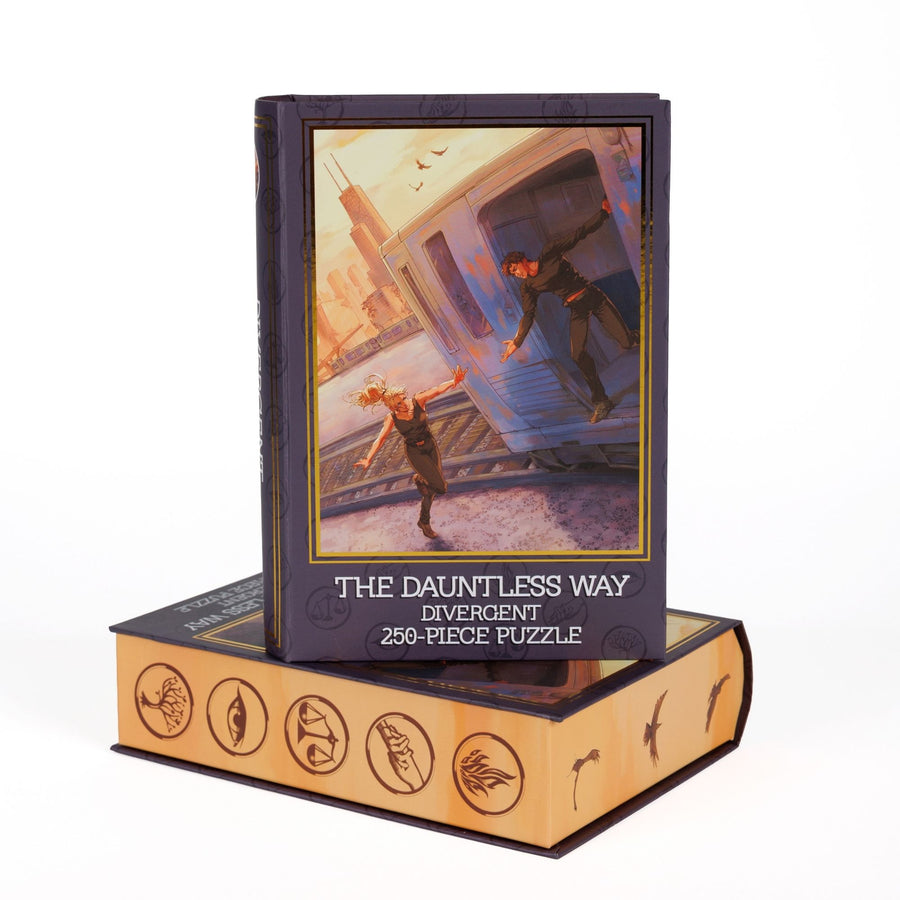 Book-shaped black box for The Dauntless Way Divergent 250-piece puzzle. Art on the front is of Tris and Four jumping on the Dauntless train.