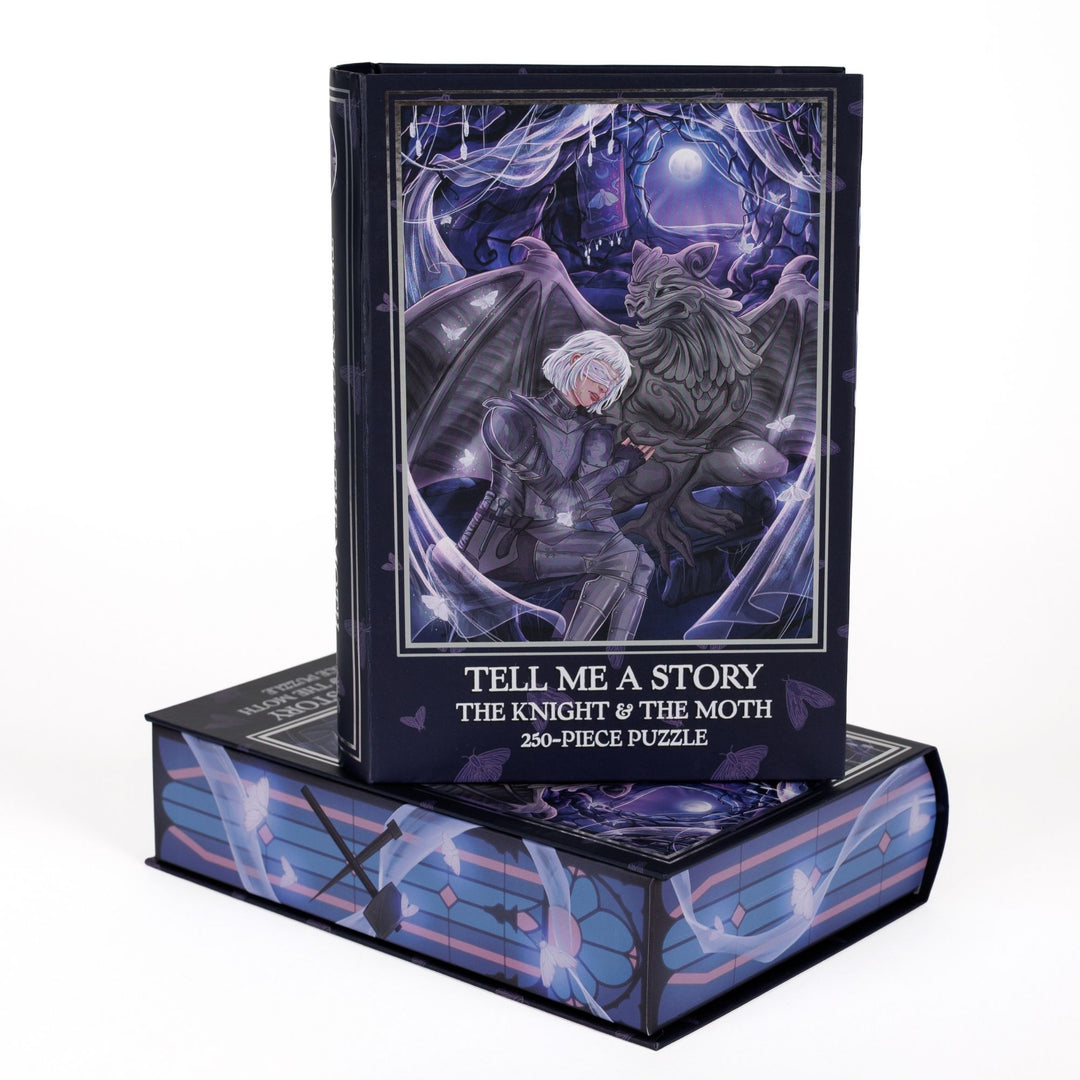 Book-shaped black box for Tell Me a Story The Knight & the Moth 250-piece puzzle. Art on the front is of Sybil and Bartholomew.