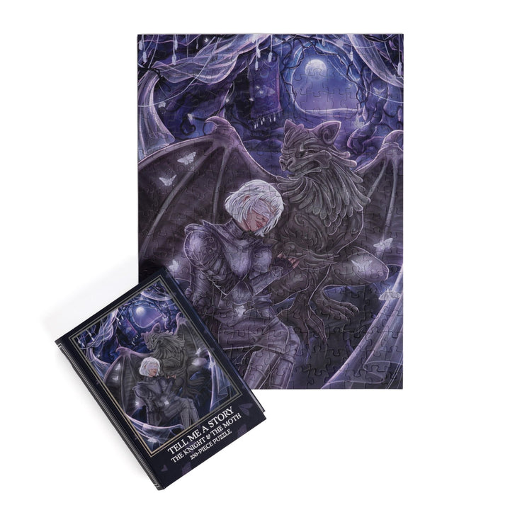 Full completed puzzle of Sybil and Bartholomew and dark blue, book-shaped box for Tell Me a Story The Knight & the Moth 250-piece puzzle
