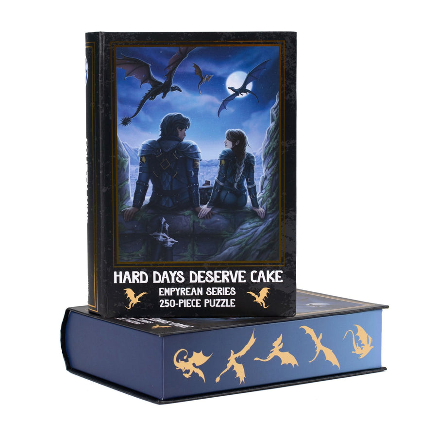 Book-shaped black box for Hard Days Deserve Cake Fourth Wing 250-piece puzzle. Art on the front is of Xaden and Violet.