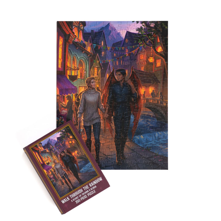 Completed puzzle of Feyre and Rhys and purple, book-shaped box with matching art for Walk Through the Rainbow, A Court of Thorns and Roses 250-piece puzzle.