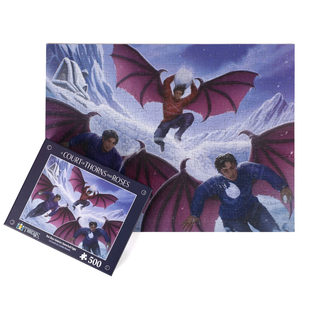Completed puzzle of Rhys, Azriel, and Cassian having a snowball fight with the puzzle box with matching art for Bat Boys Solstice Snowball Fight A Court of Thorns and Roses 500 piece puzzle.